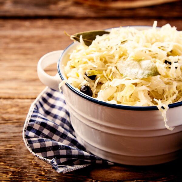 Bowl of sauerkraut in close up on wooden table